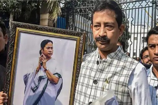 A teary-eyed Rajib Banerjee had gone to submit his resignation as a TMC legislator earlier this year, holding a Mamata Banerjee portrait. File pic/PTI