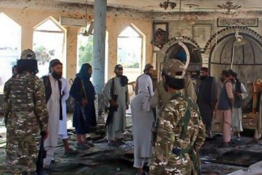 Taliban fighters investigate inside a Shiite mosque after a suicide bomb attack in Kunduz on October 8. (AFP) Taliban fighters investigate inside a Shiite mosque after a suicide bomb attack in Kunduz on October 8. (AFP)