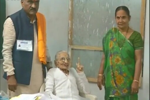 Prime Minister Narendra Modi’s mother Hiraba reached a polling booth at a government school at Raysan in the city’s ward number 10, where she cast her vote. (File photo/ANI)