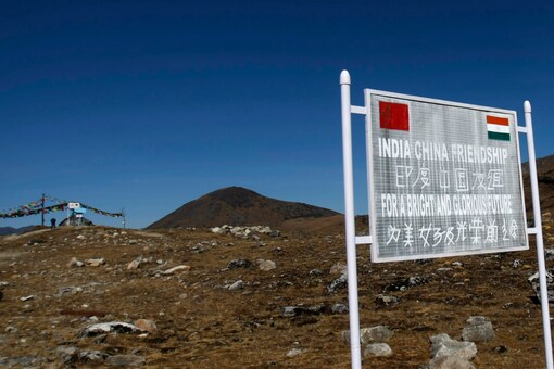 A signboard is seen from the Indian side of the Indo-China border at Bumla, in the northeastern Indian state of Arunachal Pradesh. REUTERS/Adnan Abidi

