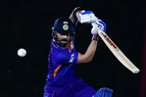 (FILES) In this file photo taken on October 18, 2021, India's captain Virat Kohli plays a shot during the warmup cricket match between India and England for the ICC men’s Twenty20 World Cup at the ICC Cricket Academy Ground in Dubai. Virat Kohli's India begin the Twenty20 World Cup as one of the favourites and take on arch-rivals Pakistan in Dubai on October 24, 2021. Aamir QURESHI / AFP