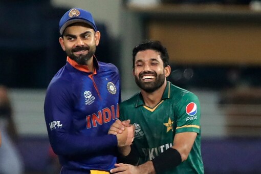 Indian cricket captain Virat Kohli, left, hugs Pakistan's Mohammad Rizwan after Pakistan won the the Cricket Twenty20 World Cup match between India and Pakistan in Dubai, UAE, Sunday, Oct. 24, 2021. (AP Photo/Aijaz Rahi)