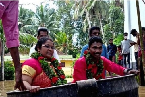 The couple -- Akash and Aishwarya -- were seen travelling in the cooking vessel in videos that went viral on social media. (Screengrab from Twitter)