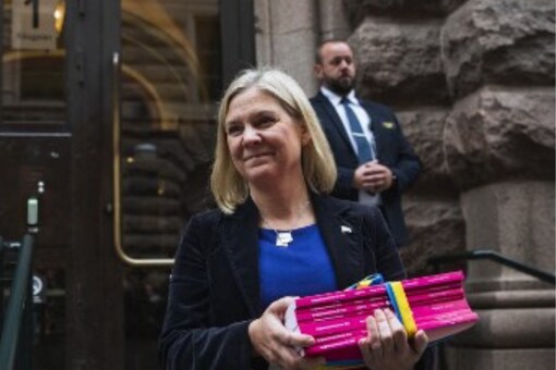 Magdalena Andersson (2ndL) is pictured during the traditional walk from the Finance department to the Parliament where she will present the 2022 budget proposal before deputies on September 20, 2021 in Stockholm.
Jonathan NACKSTRAND / AFP