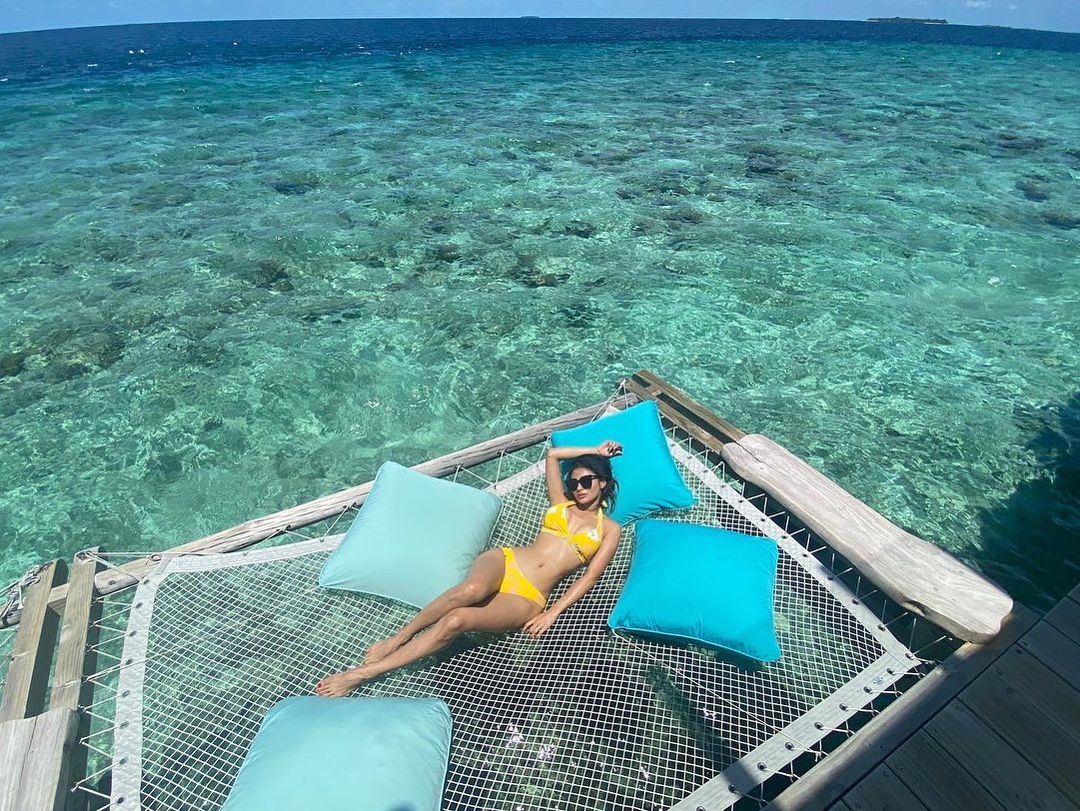 Mouni Roy enjoys her time at the pool in a sexy yellow bikini