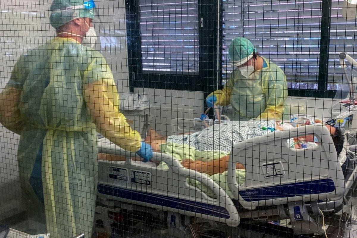 Medical staff members of Munchen Klinik Schwabing hospital take care of a patient infected with the coronavirus disease in the intensive care unit in Munich, Germany. (Image: Ayhan Uyanik/Reuters)