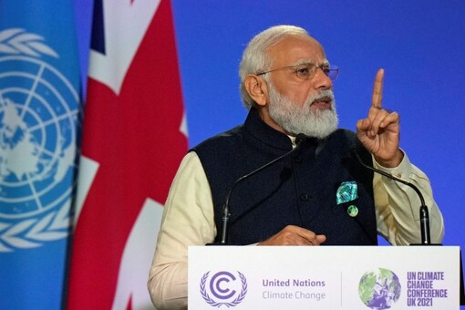 Prime Minister Narendra Modi gestures as he makes a statement at the UN Climate Change Conference (COP26) in Glasgow. (Image: Reuters)