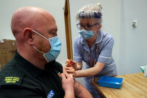 A healthcare worker receives a COVID-19 vaccine at the Centre for Life vaccination hub, amid the coronavirus disease (COVID-19) outbreak, in Newcastle, Britain January 11, 2021. REUTERS/Lee Smith