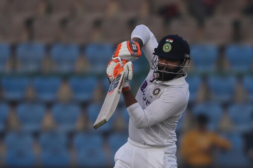 India's Ravindra Jadeja plays a shot during the day one of their first test cricket match with New Zealand in Kanpur, India, Thursday, Nov. 25, 2021. (AP Photo/Altaf Qadri)