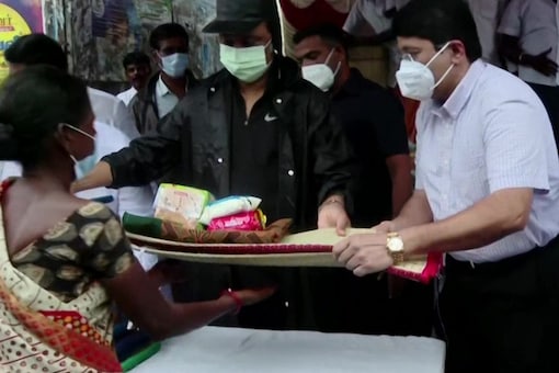 Tamil Nadu CM MK Stalin distributes relief material and food to the people. (File photo: ANI)