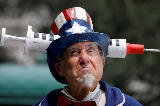 A person dressed as Uncle Sam attends an anti-mandatory coronavirus disease (COVID-19) vaccine protest. (Image: Reuters)