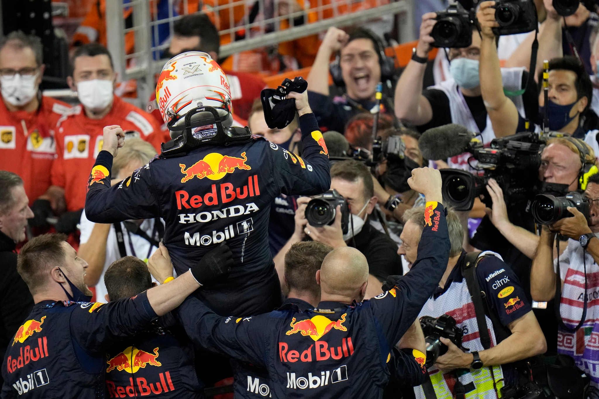 Red Bull driver Max Verstappen of the Netherlands celebrates after he became the world champion after winning the Formula One Abu Dhabi Grand Prix in Abu Dhabi, United Arab Emirates, Sunday, Dec. 12, 2021, (AP Photo/Hassan Ammar)