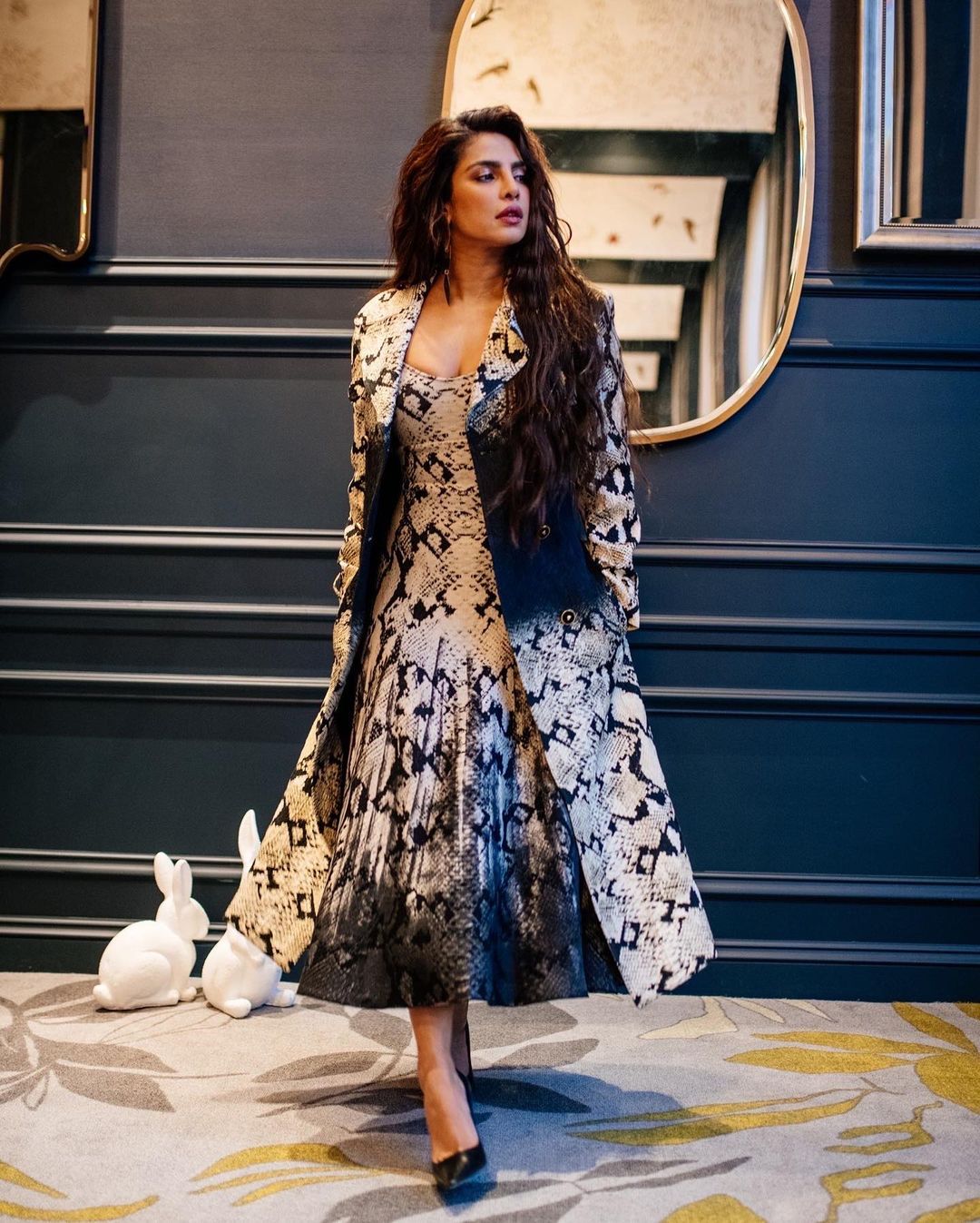 Priyanka Chopra looks elegant in the midi dress with a matching coat.