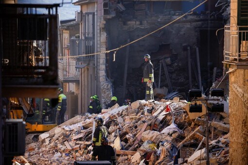 Rescuers work at the site of a gas explosion that caused several houses to collapse in Ravanusa, Italy, December 13, 2021. REUTERS
