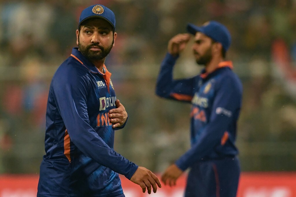 India's captain Rohit Sharma (L) looks on after winning the third Twenty20 International cricket match between India and New Zealand at the Eden Gardens in Kolkata on November 21, 2021. (Photo by Dibyangshu SARKAR / AFP)