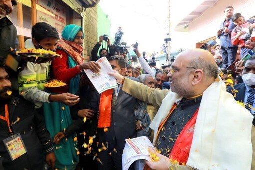 Amit Shah during a door-to-door campaign in Uttar Pradesh. He will be campaigning for nine days for the remaining five phases. (Photo: News18 File)