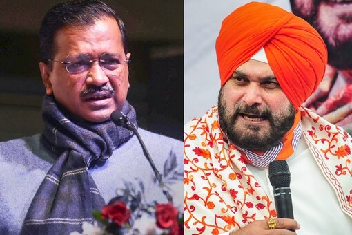 Navjot Singh Sidhu (R)  has accused Arvind Kejriwal of running 'a fake propaganda' through the ‘Janta Chunegi Apna CM’ drive in Punjab. (PTI Photos)