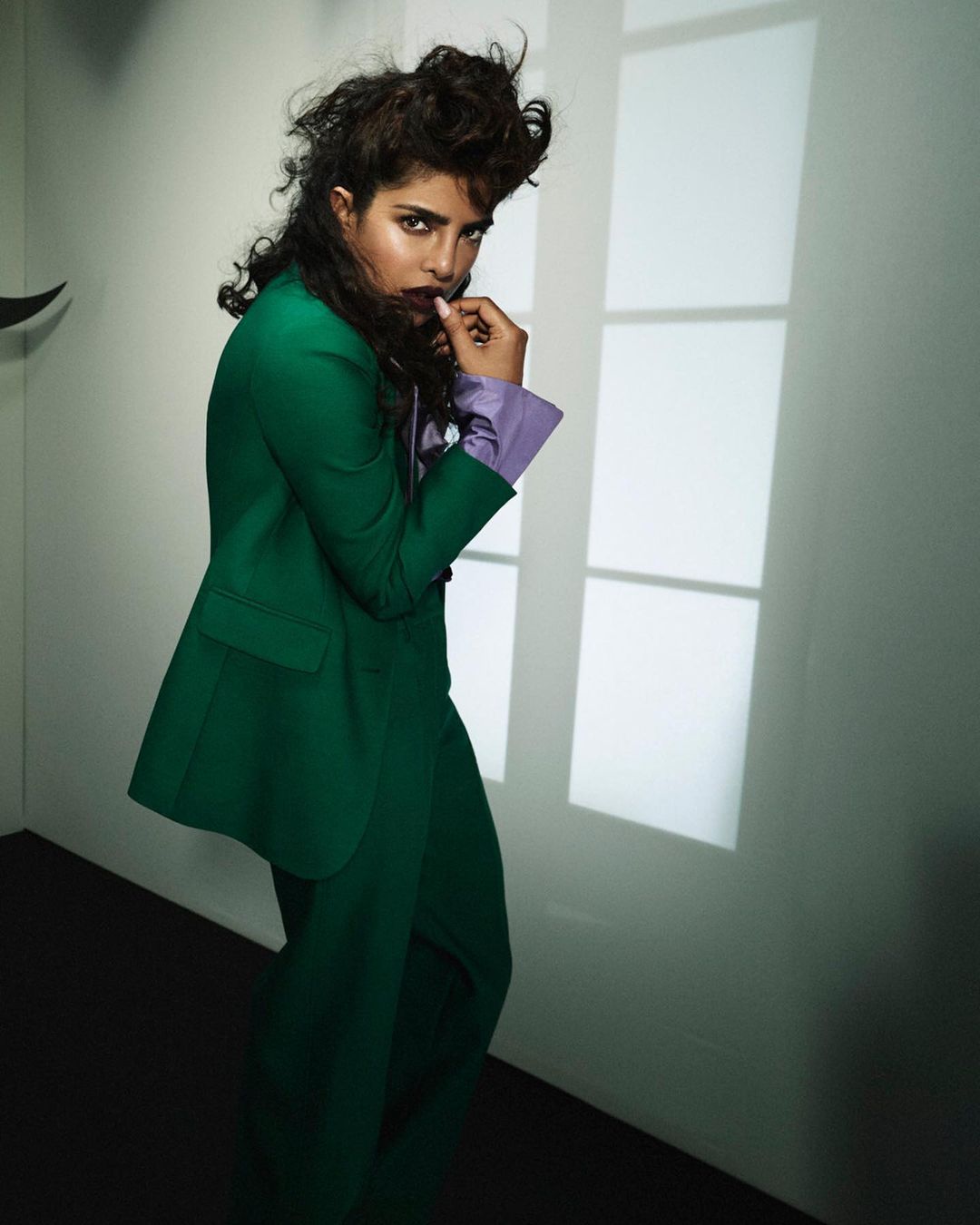 Priyanka Chopra looks smart in the green pantsuit. 