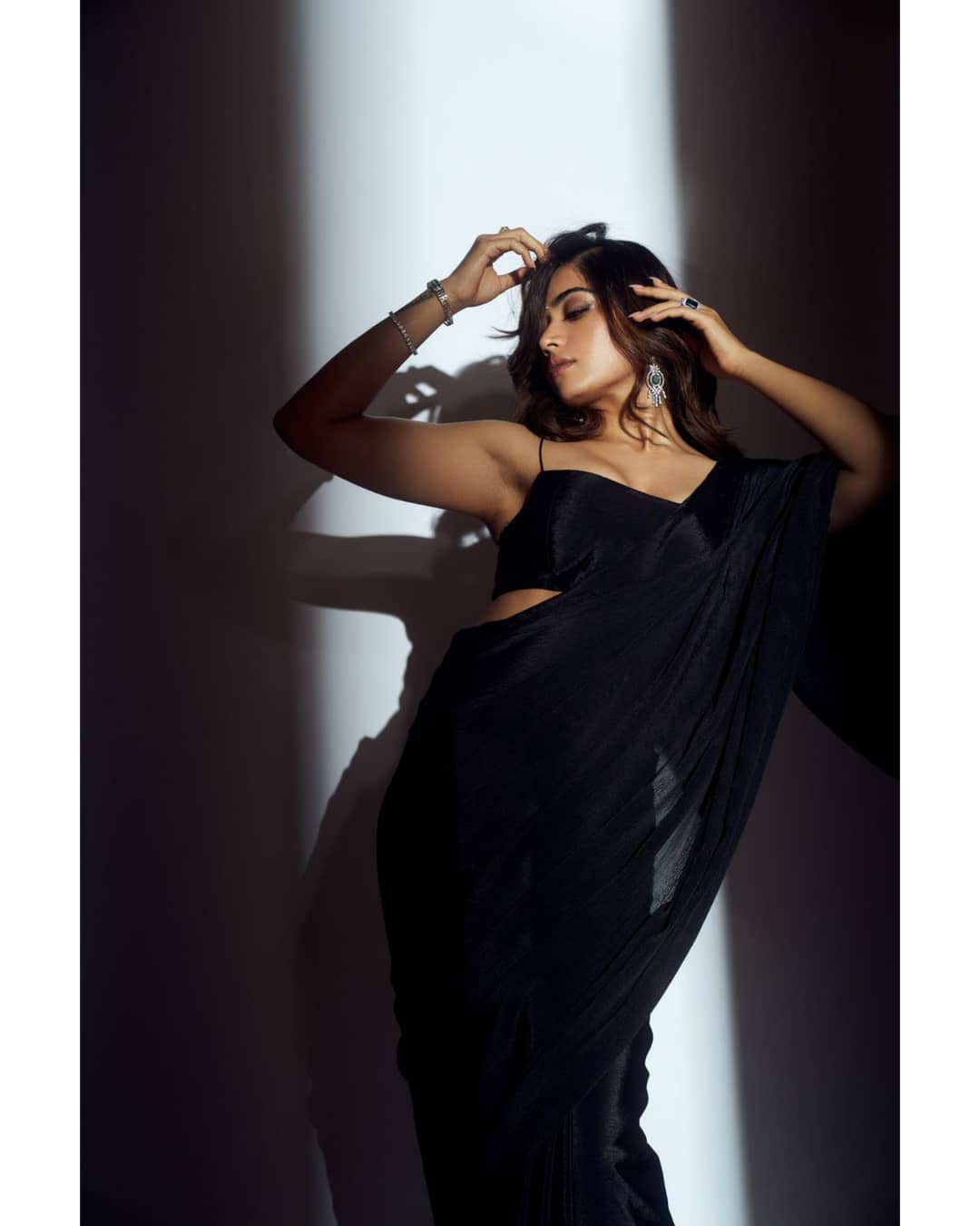 Rashmika Mandanna looks sultry in the plain black saree. (Image: Instagram) Rashmika Mandanna looks sultry in the plain black saree.