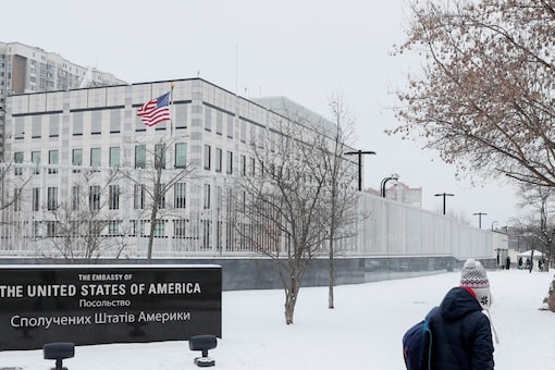 People walk near the US embassy in Kyiv, Ukraine. The United States said in a statement it was ordering the departure of eligible family members of staff from its embassy in Ukraine and said all citizens should consider leaving due to the threat of military action from Russia. (Image: Reuters) People walk near the US embassy in Kyiv, Ukraine. The United States said in a statement it was ordering the departure of eligible family members of staff from its embassy in Ukraine and said all citizens should consider leaving due to the threat of military action from Russia. (Image: Reuters)