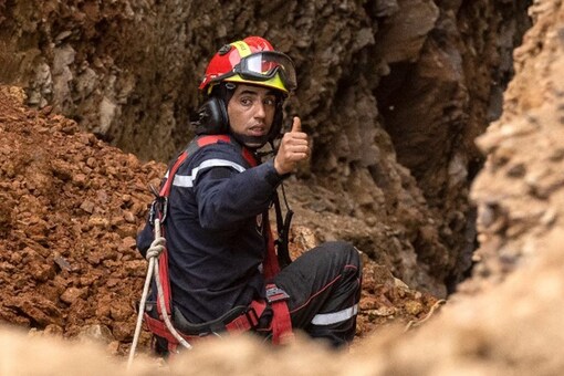 A member of the Moroccan emergency services gestures as teams work on the rescue of five-year-old boy Rayan from a well shaft he fell into on February 1, in the remote village of Ighrane in the rural northern province of Chefchaouen (Image: AFP)