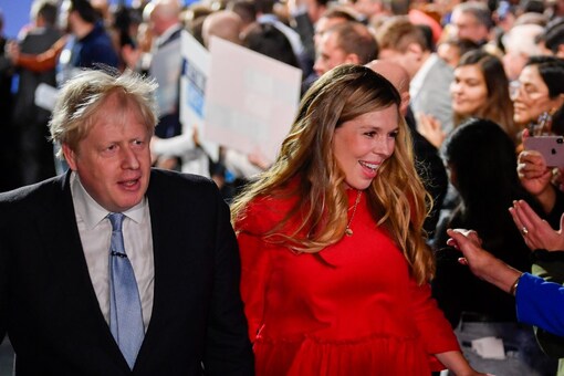 Boris Johnson and his wife Carrie Johnson seen at the annual Conservative Party Conference, in Manchester, Britain in this file photo from 2021 (Image: Reuters)