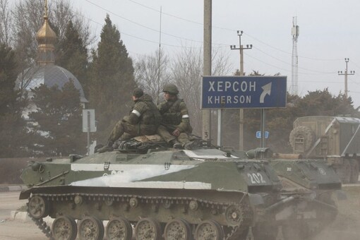 Servicemen ride on an armoured vehicle with the letter 'Z' on it, after Russian President Vladimir Putin authorised a military operation in eastern Ukraine, in the town of Armyansk, Crimea, on Thursday. (Image: REUTERS/Stringer)