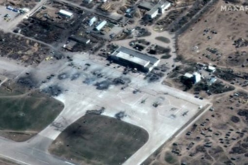 This Maxar satellite image taken and released on March 16, 2022 shows destroyed Russian helicopters on the tarmac at Kherson Airfield, Kherson, Ukraine. (AFP)