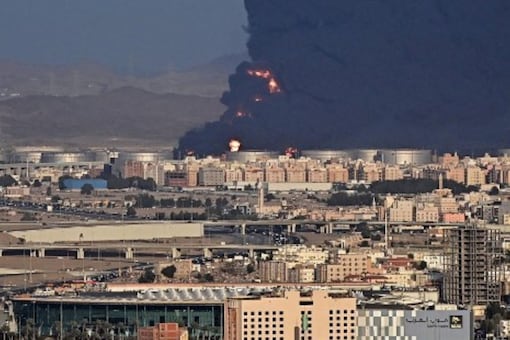 Smoke billows from an oil storage facility in Saudi Arabia's Red Sea coastal city of Jeddah on March 25, 2022. Yemeni rebels said they attacked a Saudi Aramco oil facility in Jeddah as part of a wave of drone and missile assaults today as a huge cloud of smoke was seen near the Formula One venue in the city. (AFP) Smoke billows from an oil storage facility in Saudi Arabia's Red Sea coastal city of Jeddah on March 25, 2022. Yemeni rebels said they attacked a Saudi Aramco oil facility in Jeddah as part of a wave of drone and missile assaults today as a huge cloud of smoke was seen near the Formula One venue in the city. (AFP)