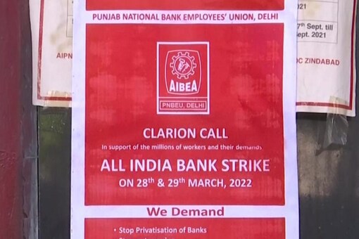 A Union of Punjab National Bank in Delhi that went on strike today demands various things in a poster. (Image: Twitter/ ANI)