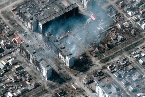 This satellite image provided by Maxar Technologies shows burning and destroyed apartment buildings in Mariupol, Ukraine Tuesday, March 22, 2022. (Satellite image ©2022 Maxar Technologies via AP)