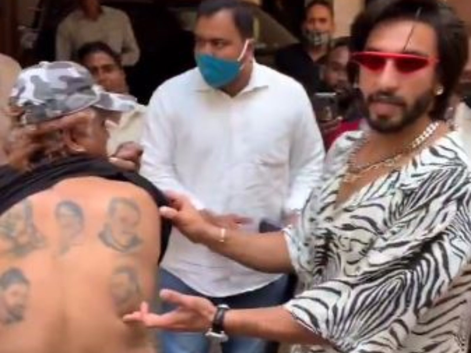 Ranveer Singh hugs his fan who gets a tattoo of the actors face on his  back  Filmfarecom