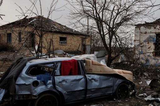 A car lies destroyed following Russian shelling in Ukraine's Byshiv (Image: Reuters)