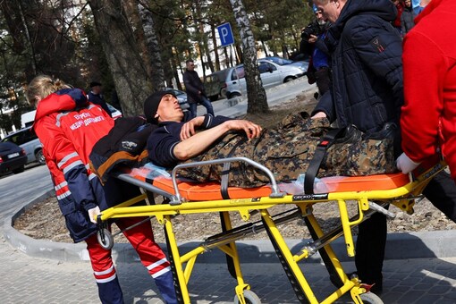 Medics move a wounded soldier, following an attack on the Yavoriv military base, amid Russia's invasion of Ukraine, at a hospital in Yavoriv, Ukraine (Image: Reuters)