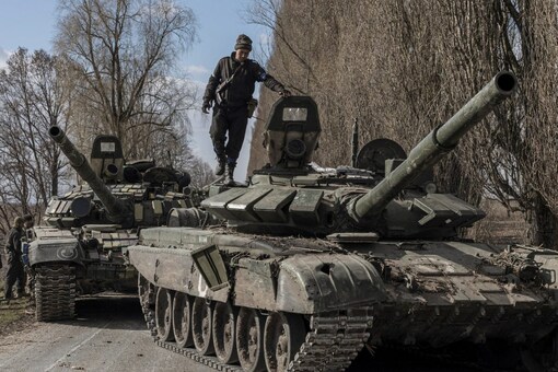 A Ukranian serviceman stands on top of a Russian tank captured after fighting with Russian troops in the village of Lukyanivka outside Kyiv, Ukraine (Image: Reuters) A Ukranian serviceman stands on top of a Russian tank captured after fighting with Russian troops in the village of Lukyanivka outside Kyiv, Ukraine (Image: Reuters)