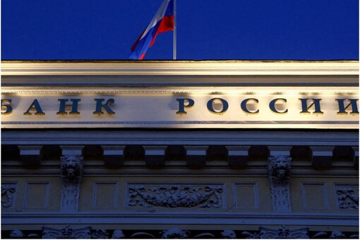 A Russian state flag flies over the Central Bank headquarters in Moscow, Russia. A sign reads: "Bank of Russia". (Image: Reuters file)