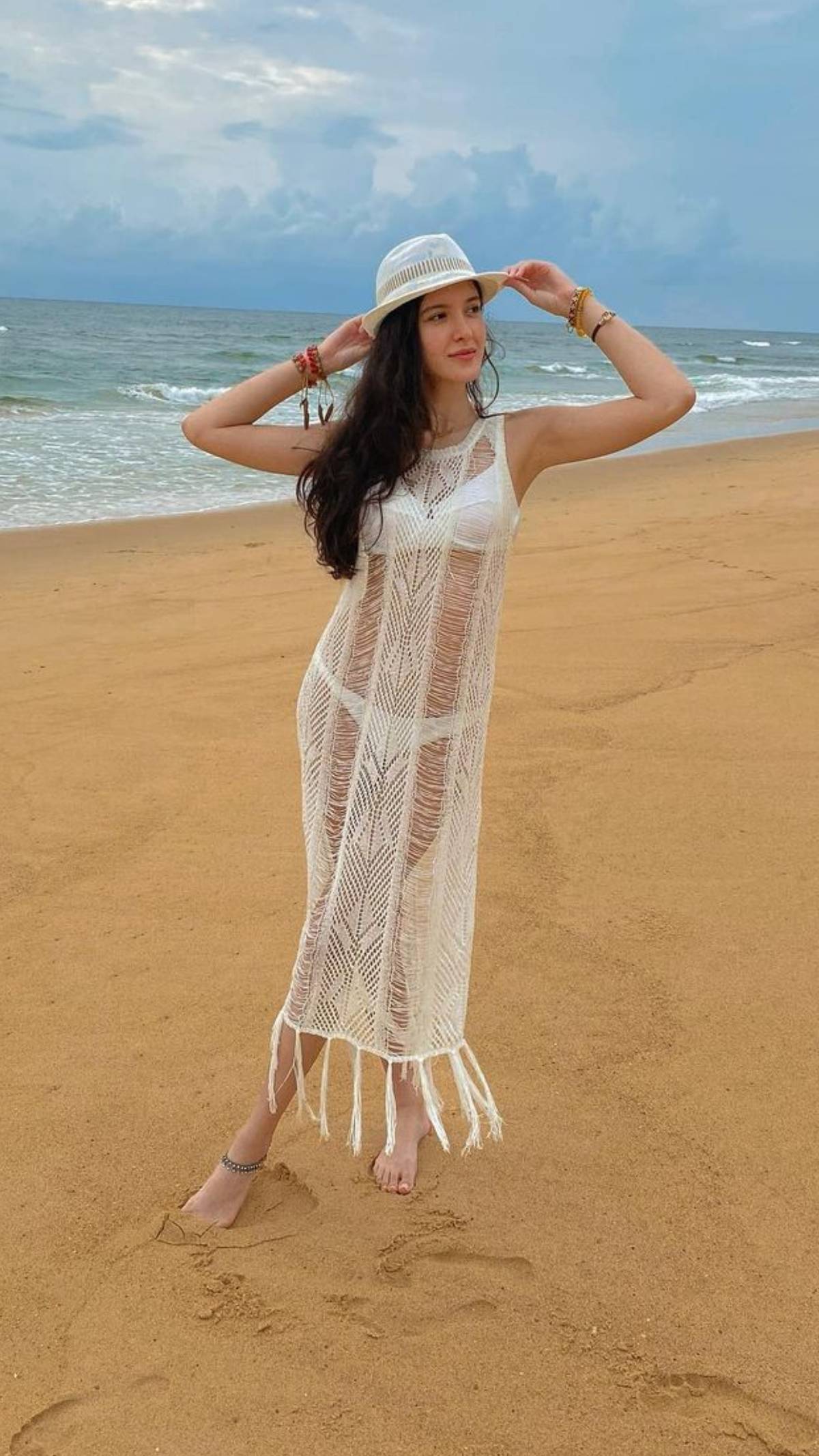 Shanaya Kapoor looks super sexy in the white bikini and the lace overlay.