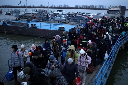 People arrive by ferry after fleeing from Russia's invasion of Ukraine, at the Isaccea-Orlivka border crossing in Romania on Sunday. (Image: REUTERS/Stoyan Nenov)