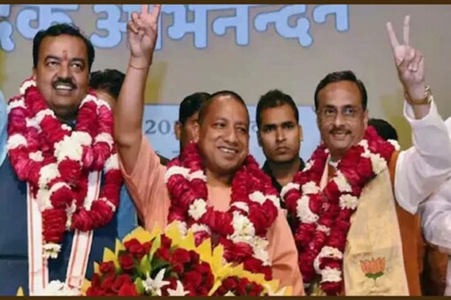 Sources said the two deputy chief ministers, Keshav Prasad Maurya and Brajesh Pathak, may be given charge of development-oriented ministries. (Image: News18)