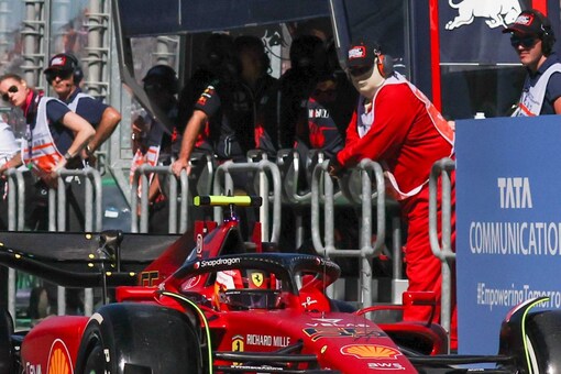 Ferrari driver Carlos Sainz of Spain steers his car down pit lane during the first practice session for the Australian Formula One Grand Prix in Melbourne, Australia, Friday, April 8, 2022. (AP Photo/Asanka Brendon Ratnayake)