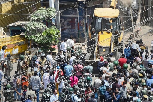 Jahangirpuri C and D blocks have homes of lower-class Muslim families who migrated to Delhi for jobs from West Bengal, writes Sayantan Ghosh. (PTI Photo/Shahbaz Khan)