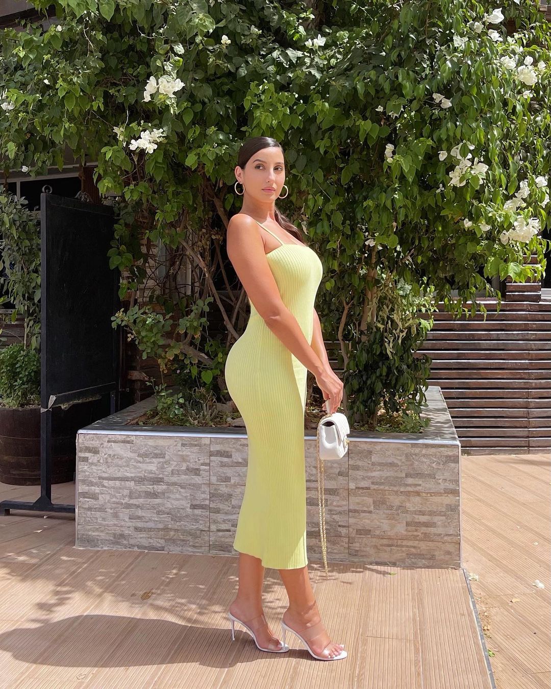 Nora Fatehi looks spectacular in the green bodycon dress.