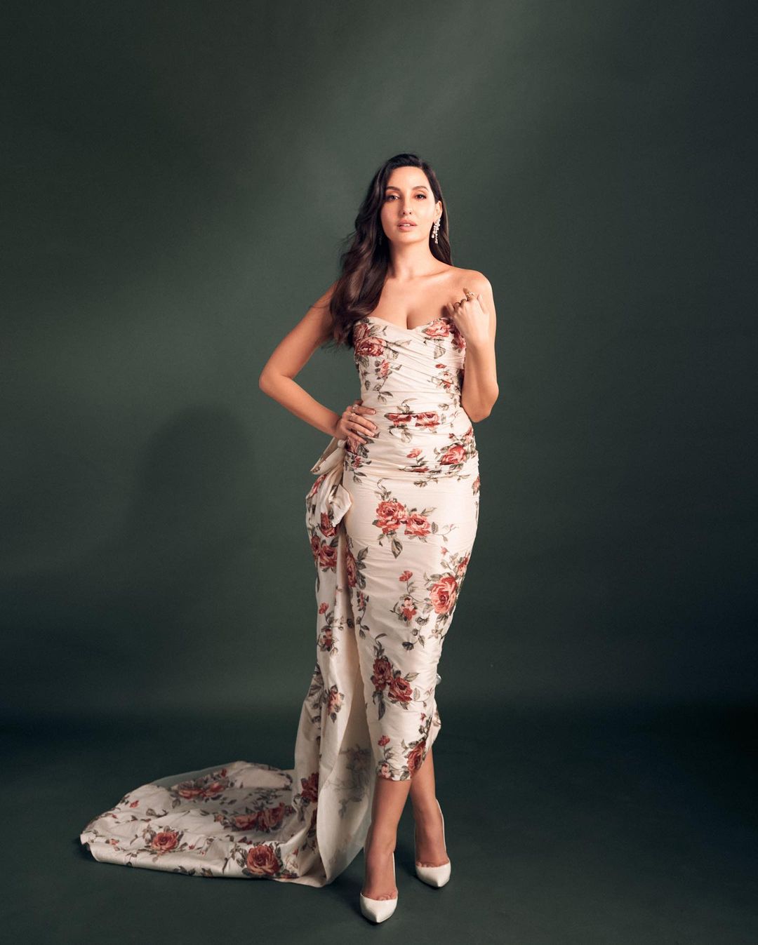 Nora Fatehi paints an elegant picture in the floral dress.