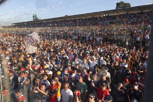 Spectators watch the trophy presentation at the Australian GP (AP Photo)