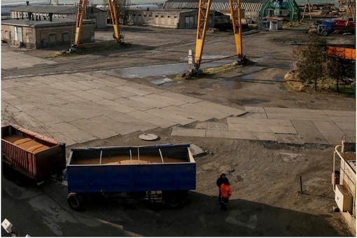 A truck with grain and cranes are seen in the Azov Sea port of Berdyansk, Ukraine. (Image: Reuters file)

