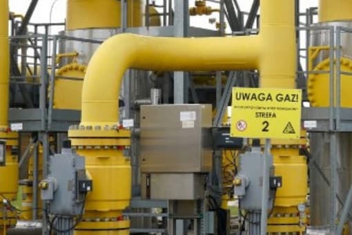 The lettering on a sign reads 'Uwaga gaz (attention gas)' at the gas transmission point in Rembelszczyzna near Warsaw. (Image: JANEK SKARZYNSKI/AFP)