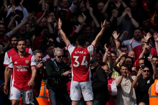 Arsenal's Granit Xhaka celebrates after scoring his side's third goal during an English Premier League match between Arsenal and Manchester United at the Emirates stadium in London, Saturday April 23, 2022. (AP Photo/Alastair J. Grant)