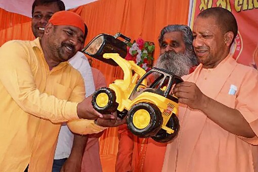 'Bulldozers', used to raze illegal buildings, figured repeatedly in election campaign speeches by BJP leaders. (PTI)