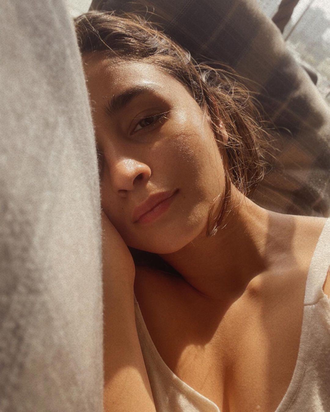 Alia Bhatt looks stunning as she lazes around with the sun on her face.