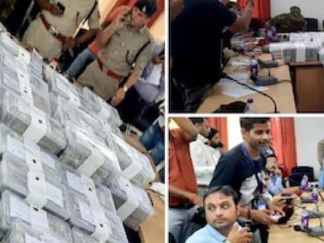 Police officials count the money seized from the gang. (Image: News18)